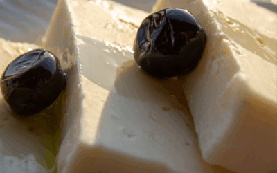 Aceitunas negras El Cabildo con queso de cabra gratinado y reducción de vino tinto